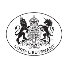 Black and white Lord-Lieutenant crest featuring a crowned lion and a unicorn holding a royal shield, with a banner reading “Lord-Lieutenant.”