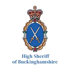High Sheriff of Buckinghamshire emblem featuring two crossed swords on a blue shield, surrounded by ornate detailing and topped with a royal crown.