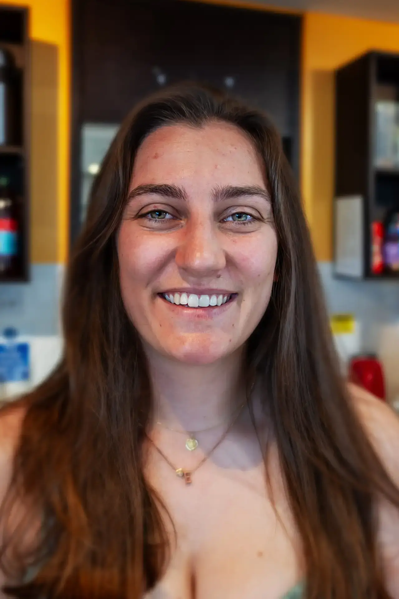 Smiling Woman with Long Brown Hair